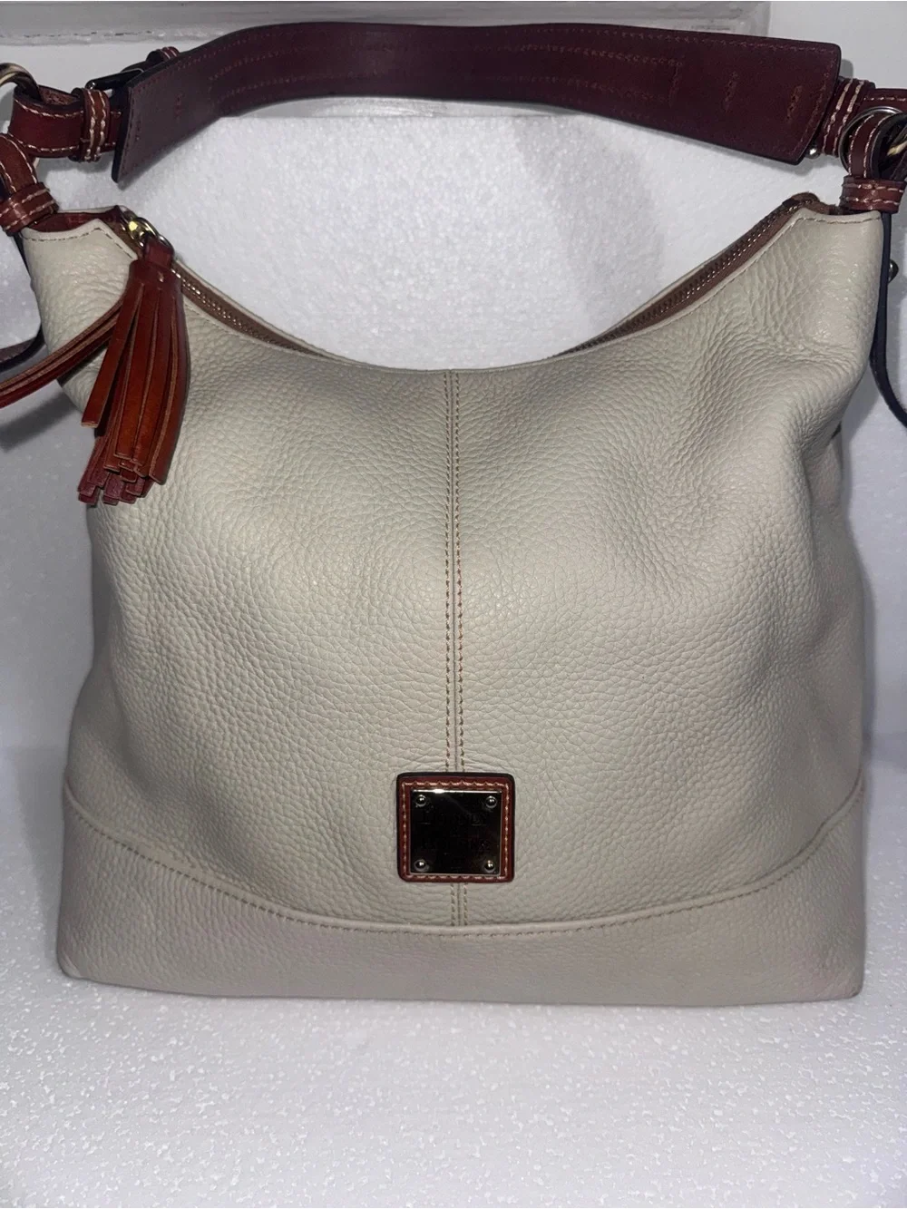 Dooney & Bourke Cream Leather Hobo with Brown Trim and Tassel
